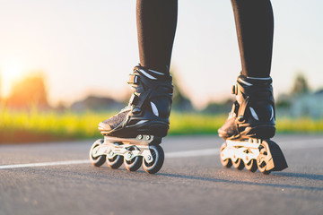 Woman in roller skates during inline skating outdoors. Active lifestyle. Teenager during...