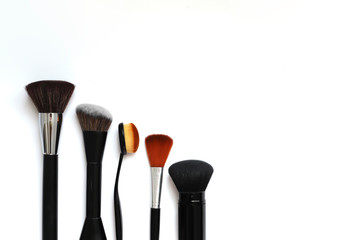 makeup brushes on white background beauty concept, self care, cosmetics store copyscape