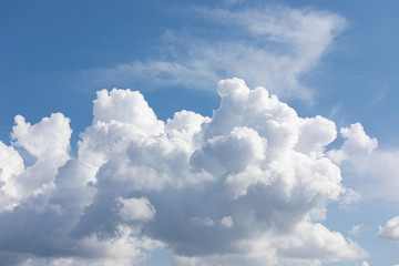 Naklejka na ściany i meble Fluffy cloud edge and blue sky