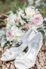 bridal shoes and bouquet