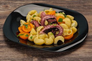 Pasta with octopus and yellow tomatoes