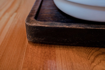 White ceramic mug on a wooden stand