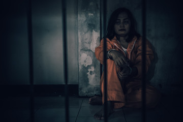 Portrait of women desperate to catch the iron prison,prisoner concept,thailand people,Hope to be...