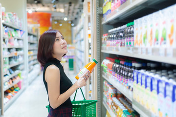 Beautiful asian woman walking shopping in a supermarket,Time for relax,Buy for dinner,Thailand people,Happy time lifestyle concept