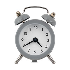 A gray clock with an alarm clock on a white background shows the arrows four hours forty minutes or sixteen hours forty minutes