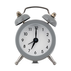 A gray clock with an alarm clock on a white background with arrows showing the time is seven hours or nineteen hours