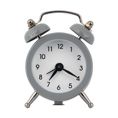 A gray clock with an alarm clock on a white background with arrows showing the time seven hours twenty minutes or nineteen hours twenty minutes