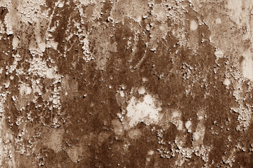 Grungy rusted metal wall surface in brown tone.