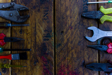 Rusty tools and Mechanic tools for repair on the wood texture background.