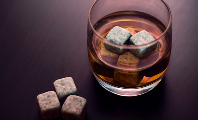 A glass of whiskey with chilled stones. Gentleman's Drink