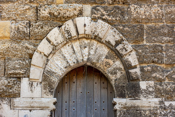 Fototapeta na wymiar Italy, Bari, view and details of the Swabian castle, an imposing fortress dating back to the 13th century. Door detail