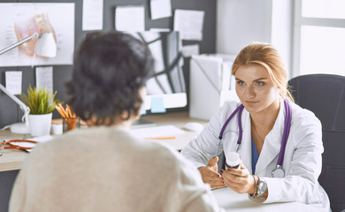 young woman doctor takes patient in office