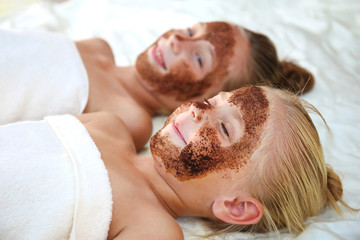 Beautiful girls with facial mask coffee scrub.