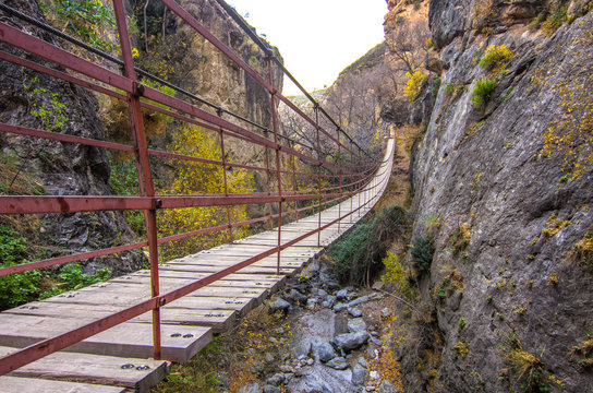Hiking trail Los Cahorros de Monachil (Granada) in Autumn. Impressive gorge carved by the Monachil River. It is a place of singular beauty with waterfalls, caves and suspension bridges.