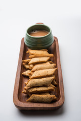 Namakpare or Salty Shakarpara/shakarpare or namkeen Shankarpali, popular diwali food or tea-time snack from Gujarat, India