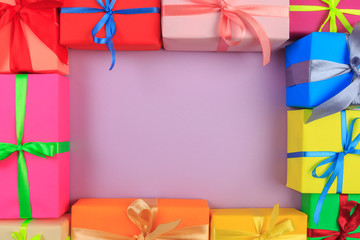 Different colored gift box on color background. Top view of various present boxes on minimal background. FRAME .Birthday, Christmas, wedding, valentine, romantic gifts - IMAGE