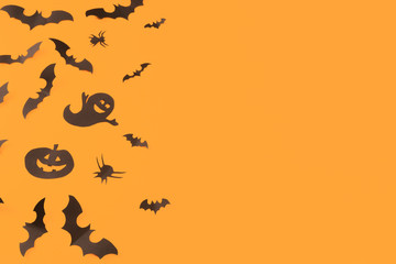 Halloween paper decorations on orange background. Halloween concept. Flat lay, top view, copy space - Image