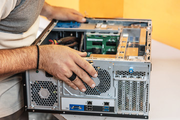 Technician repairing the computer. Concept of computer hardware, repairing, upgrade and technology .