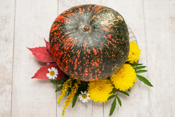 pumpkin, flowers and leaves, autumn background, flat lay, copy space, close-up