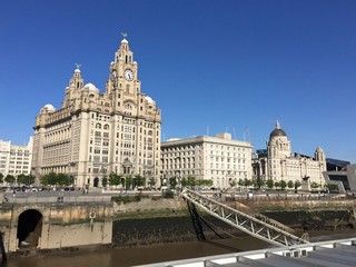 Fototapeta na wymiar Liverpool's Three Graces seen from the ferry terminal 