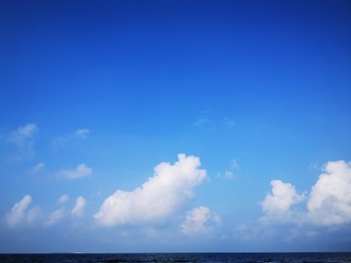 Bright blue sky with beautiful white clouds. Summer photo