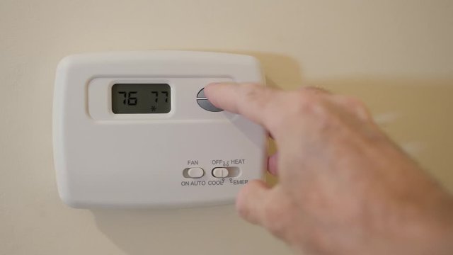 Setting digital thermostat to cool and programming air condioning to energy saving tempurature of 78 degrees.