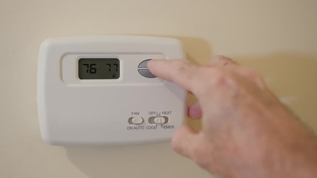 Setting digital thermostat to heat and programming heater to energy saving tempurature of 78 degrees.