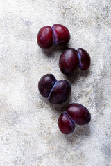 Ugly plums. Abnormal organic fruit