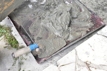 Plastering of walls with cement solution and repair of walls.