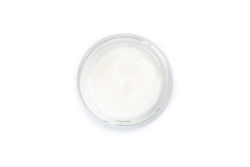 Cosmetic cream in glass jar isolated on white background