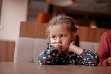 Cute little girl misses the cafe.
