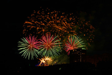 Beautiful colorful holiday fireworks in the night sky, long exposure