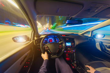 The movement of the car at speed. Blurred background view of the car dashboard.
