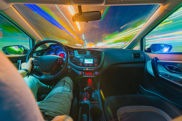 The movement of the car at speed. Blurred background view of the car dashboard.