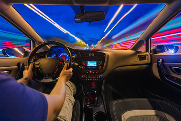 The movement of the car at speed. Blurred background view of the car dashboard.