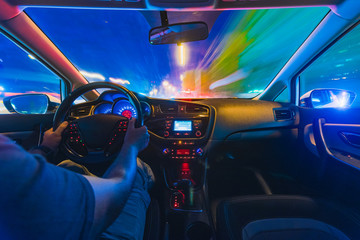 The movement of the car at speed. Blurred background view of the car dashboard.