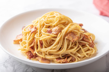 carbonara spaghetti with raw egg yolk on top