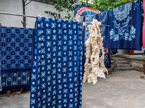 A Small Fabric Which Is Dying Clothes In A Traditional, Handmade Way. The Clothes Are First Stitch Together And Then Dyed. The Fabric Is In Zhoucheng Near The City Of Dali In Yunnan Province (China).