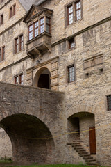 Fototapeta na wymiar Architectural detail of the Wewelsburg castle with brick construction, hidden staircase and door on the canal level and main entrance portal above