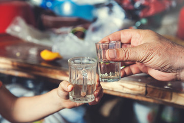 man  hand glass of vodka