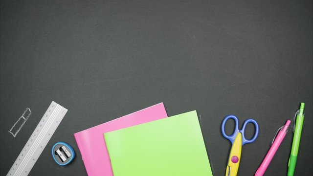 Chalk drawn school supplies and real objects appear. Stop motion