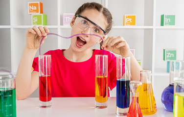 Funny girl doing chemical experiment