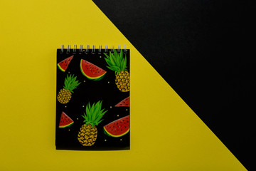 Notepad for notes on a black and yellow background