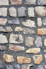 Paving stones road with gravel