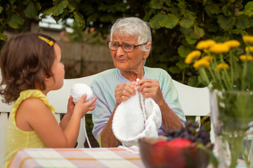 Grandma knits a warm sweater for the winter