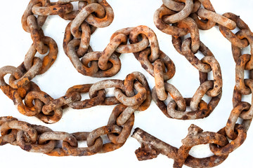 Old rusty chain on white background