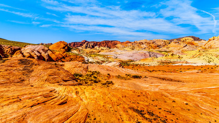 The colorful red, yellow and white banded rock formations along the Fire Wave Trail in the Valley of Fire State Park in Nevada, USA