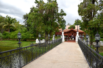 Kanchanaburi, Thailand, 09.09.2019: Beautiful garden, lake, traditional Thai, Siamese clothes, buildings of 