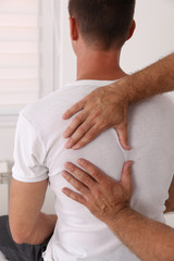 Back pain , Physiotherapy. Man Chiropractic pain relief adjustment /Kinesiology treatment ....