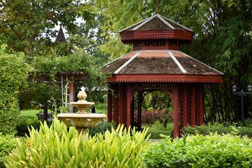 Kanchanaburi, Thailand, 09.09.2019: Beautiful garden, lake, traditional Thai, Siamese clothes, buildings of "Mallika City R.E. 124" a heritage, retro-city reflecting the real past Siamese lifestyle